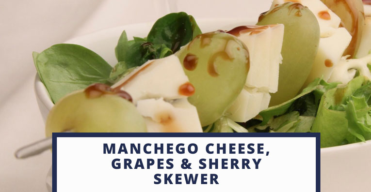 You are currently viewing Manchego Cheese with grapes skewer dressed with Sherry wine reduction